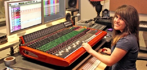 A student at a sound board.