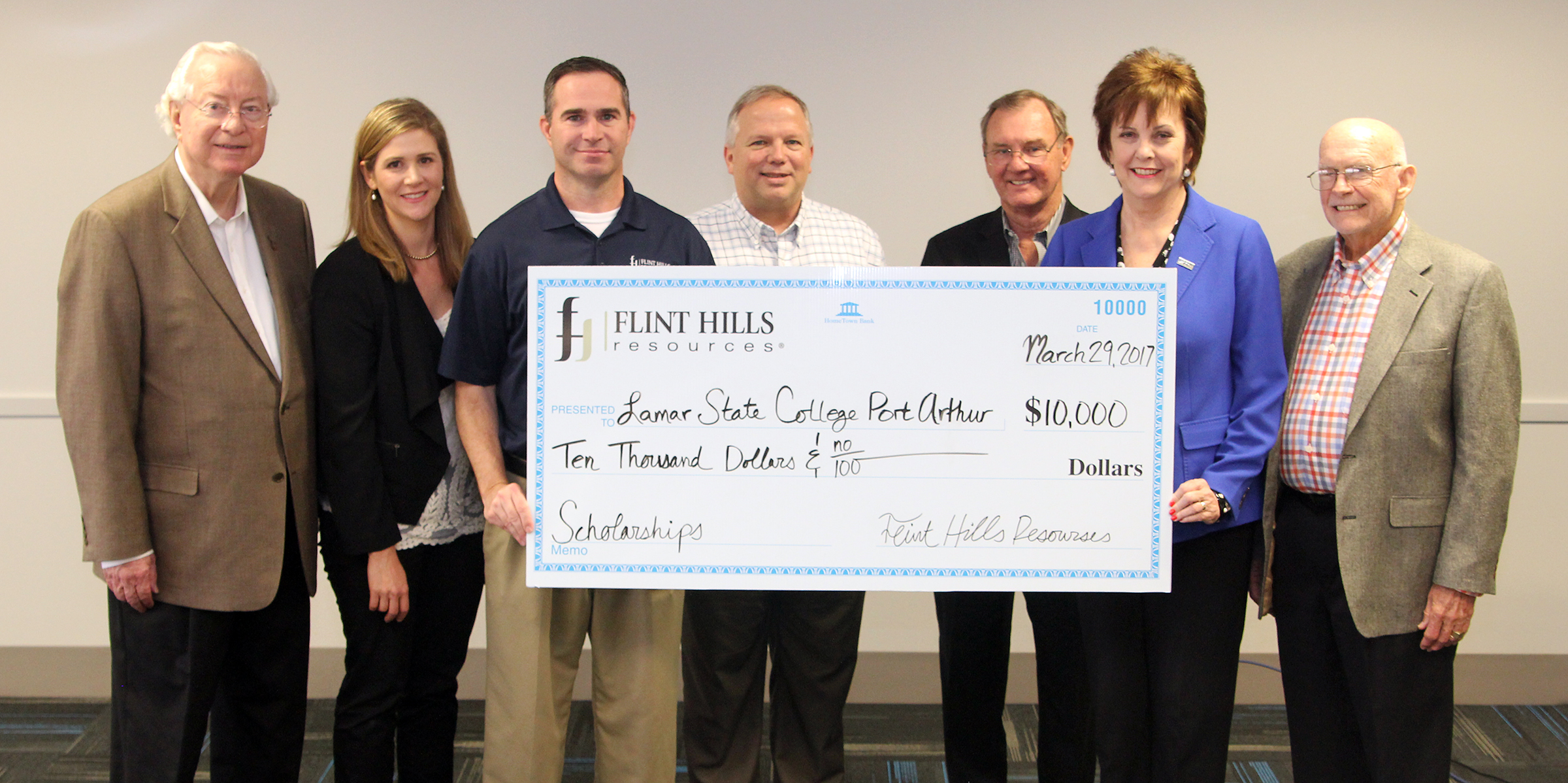 LSCPA and Flint Hills representatives holding a large check for $10,000