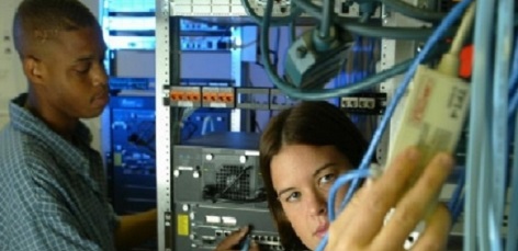 Students looking at networking cables.