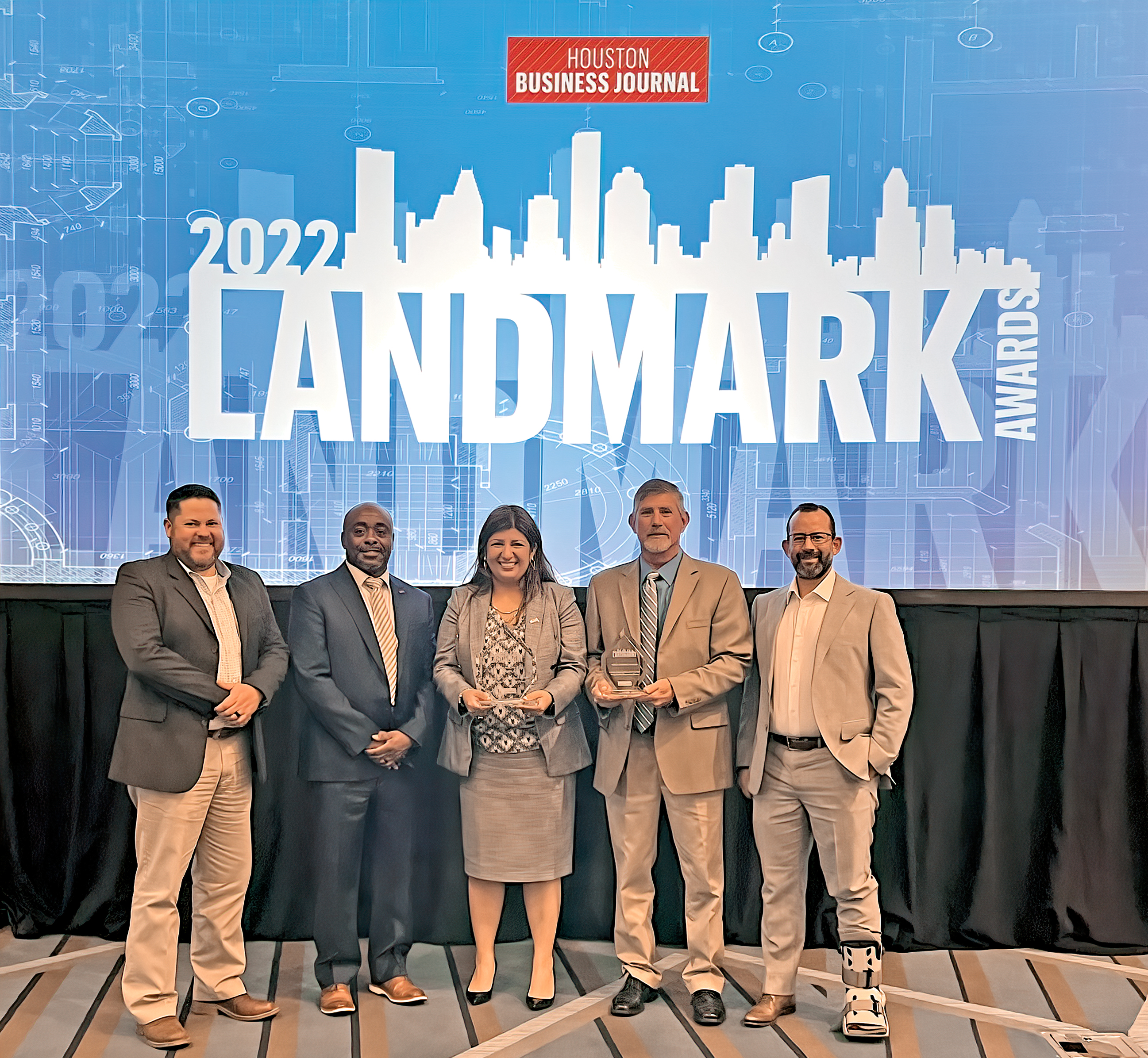 Accepting the 2022 Houston Business Journal Landmark Award for the Ruby Fuller Education Annex at Lamar State College Port Arthur are, from left, Justin Bailey, Project Manager, O’Donnell Snider Construction; Marcus Swayzer, Project Manager, Hill International, Inc.; Maria Garcia, Purchasing Director, LSCPA; Reed Richard, Physical Plant Director, LSCPA; and David Payne, Principal and Vice President, O’Donnell Snider Construction.