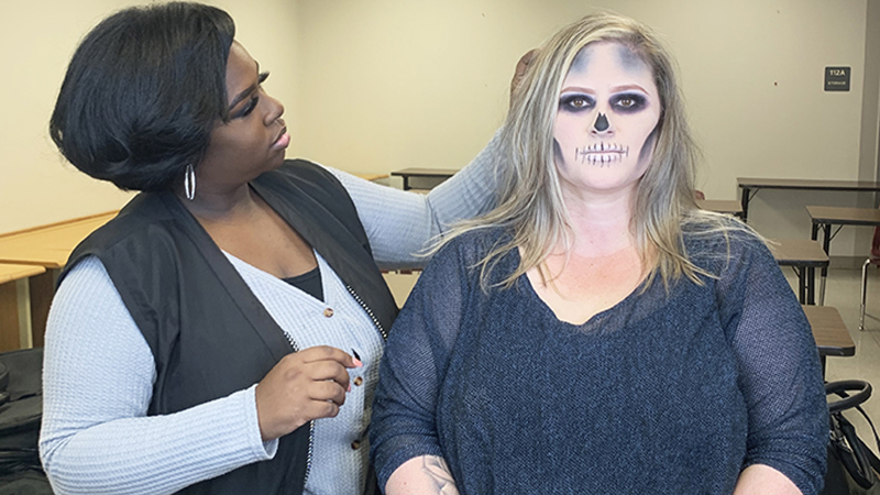 Rikki Solis models her freshly done Halloween Makeup applied by Lamar State College Port Arthur cosmetology classmate Chassity Payne at the Cosmetology Annex Building. (Cassandra Jenkins/The News)