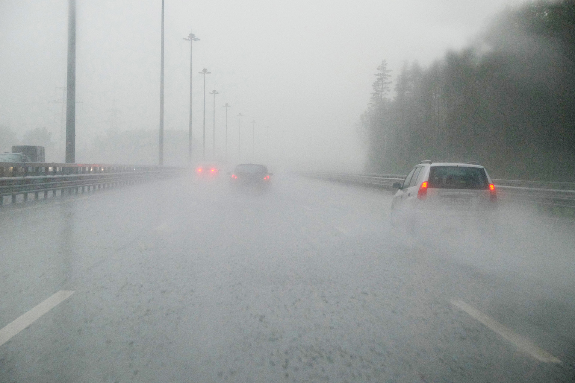 cars driving in rain