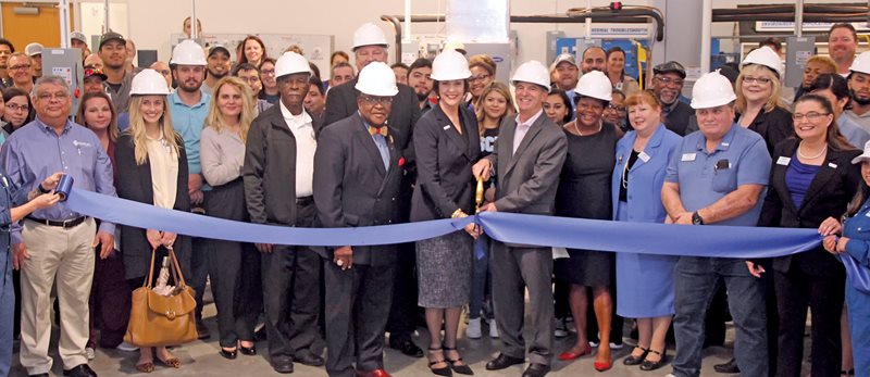Lamar State College Port Arthur President Dr. Betty Reynard cuts the ribbon on the new Motiva Petrochemical Training Facility. She was joined in the ceremony by LSCPA administrators, Motiva officials, and other community and industry representatives during a ceremony on Thursday, November 7, 2019.