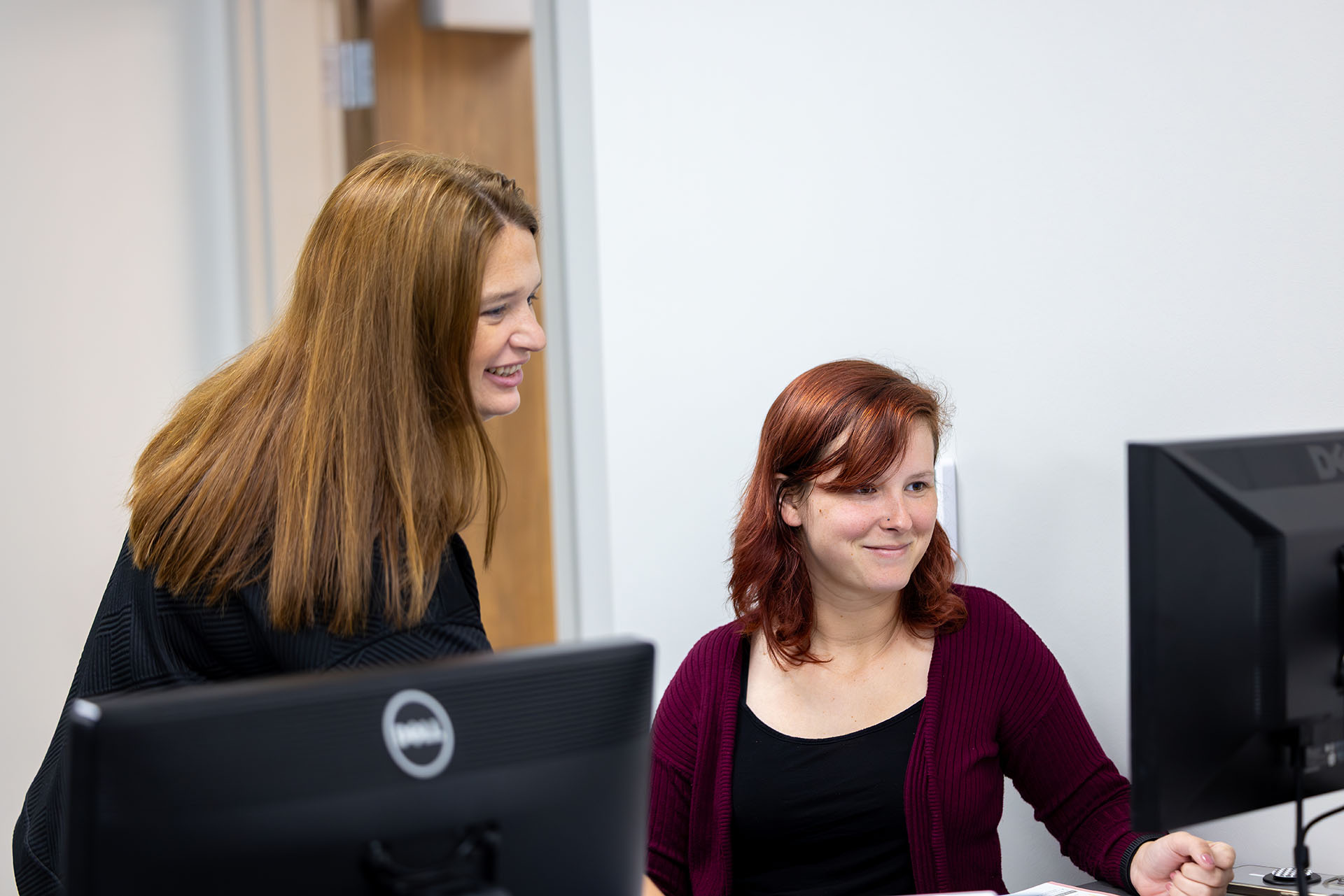 Instructor assists student in Business Administration class