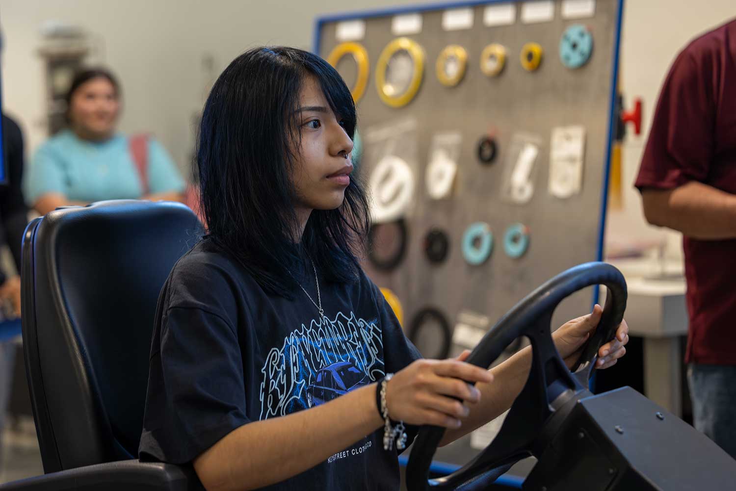 Woman practices driving simulation